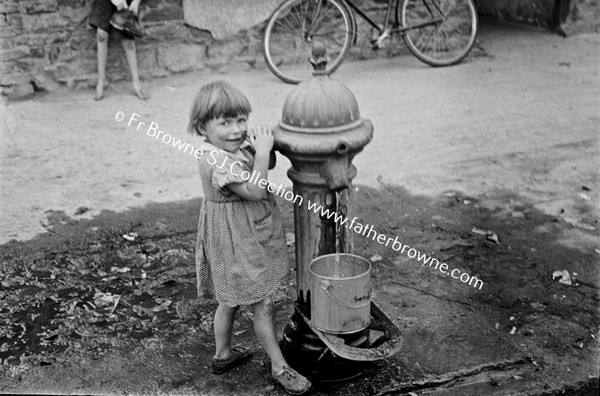 GIRL AT WATER PUMP